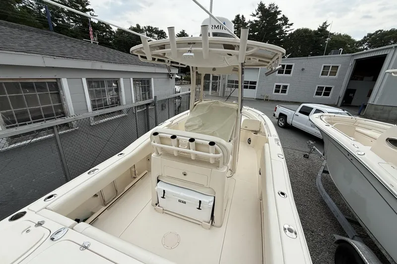 Slide: The Image of 2020 Grady-White Fisherman 257 boat docked, featuring spacious deck and center console. - 4