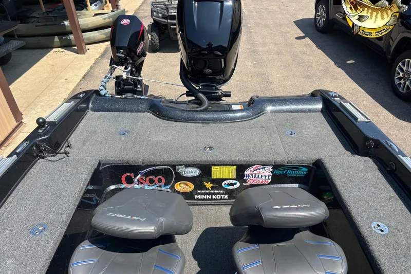 Slide: The Image of 2020 Nitro ZV21 Pro boat interior with dual seats and various brand stickers. - 5