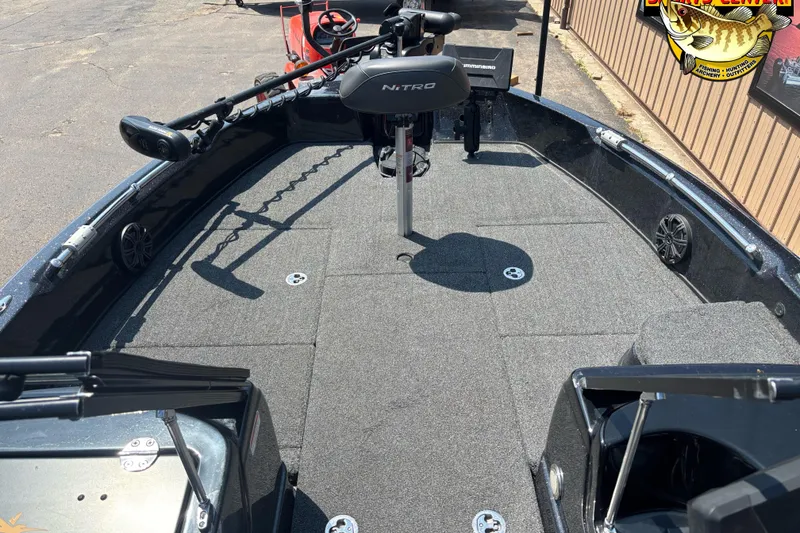 Slide: The Image of 2020 Nitro ZV21 Pro fishing boat deck with trolling motor and carpeted surface. - 10