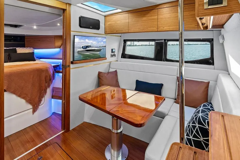 Slide: The Image of Luxurious interior of 2024 Boston Whaler 405 Conquest yacht with elegant seating and wooden accents. - 52