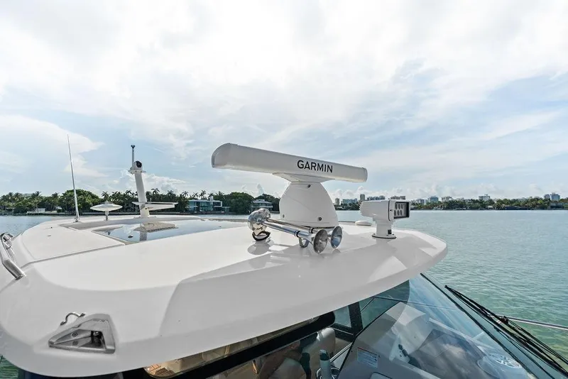 Slide: The Image of 2024 Boston Whaler 405 Conquest with Garmin radar on calm waters. - 23