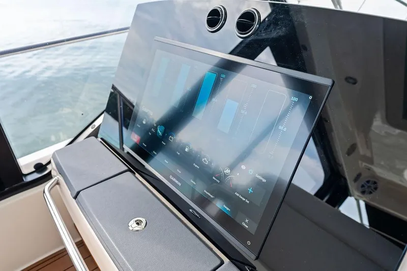 Slide: The Image of Touchscreen control panel on 2024 Boston Whaler 405 Conquest boat dashboard. - 29