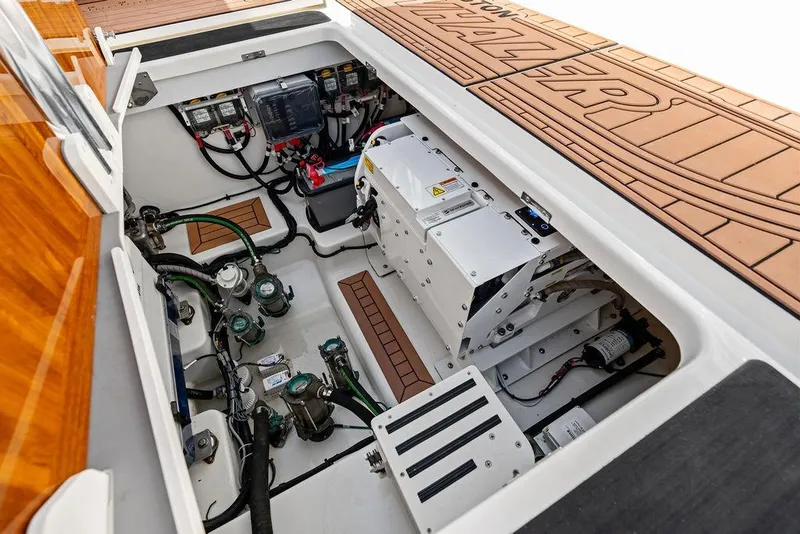 Slide: The Image of Engine compartment of 2024 Boston Whaler 405 Conquest, showcasing advanced mechanical systems. - 64