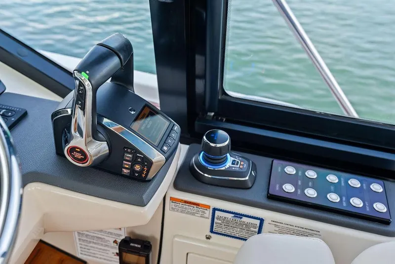 Slide: The Image of Control panel of 2024 Boston Whaler 405 Conquest boat, featuring advanced navigation technology. - 35