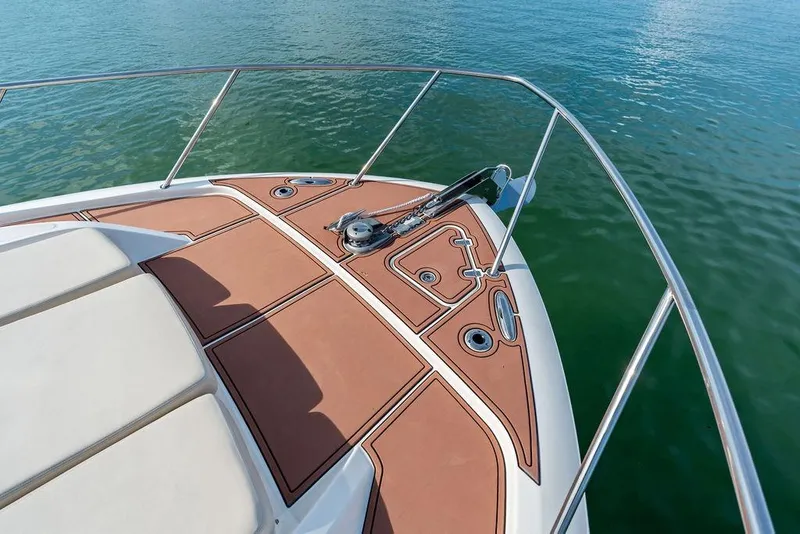Slide: The Image of Bow deck of 2024 Boston Whaler 405 Conquest, featuring sleek design and anchor system. - 20