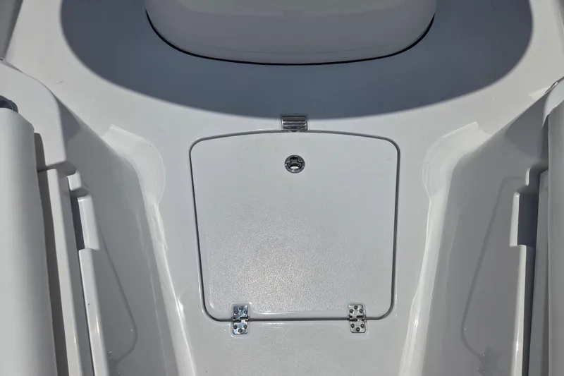 Slide: The Image of 2026 Sportsman Open 232 Center Console boat deck with storage compartment. - 9