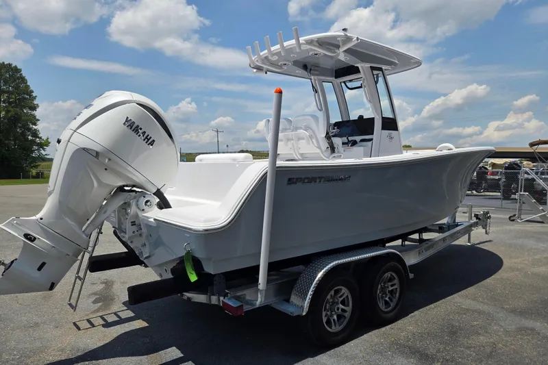 Slide: The Image of 2026 Sportsman Open 232 Center Console boat on trailer, featuring Yamaha outboard motor. - 4