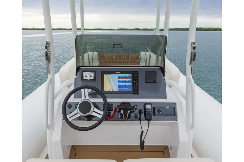 Slide: The Image of Manufacturer Provided Image: Novurania Catamaran 28 helm, 2026 model, on calm waters. - 2