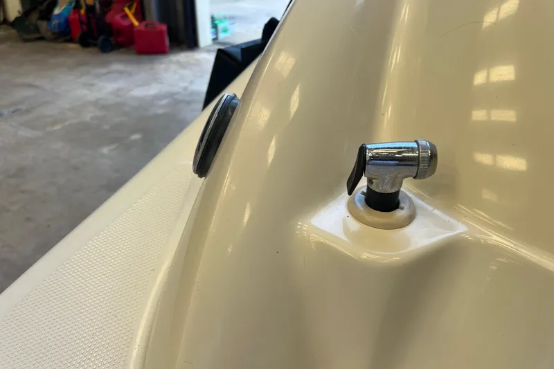 Slide: The Image of Close-up of a 2004 Sea Ray 270 Sundeck boat detail in a garage. - 17