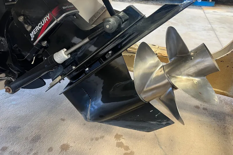 Slide: The Image of Close-up of a 2004 Sea Ray 270 Sundeck's Mercury propeller and outdrive. - 6