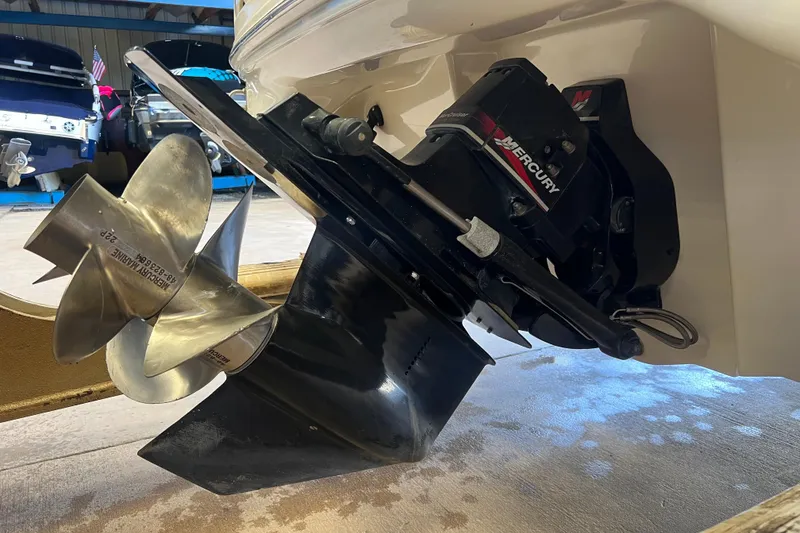 Slide: The Image of Close-up of a 2004 Sea Ray 270 Sundeck boat's Mercury propeller and outdrive. - 5