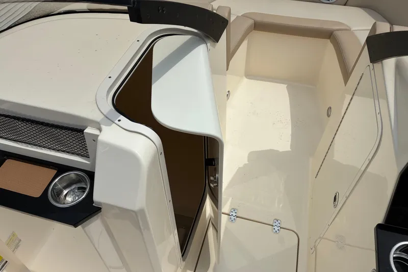 Slide: The Image of 2026 Scout 215 Dorado boat interior with open hatch and seating area. - 6
