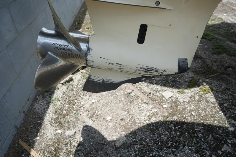 Slide: The Image of Propeller and lower unit of a 2016 Chris-Craft Catalina 34 with visible wear and scratches. - 52