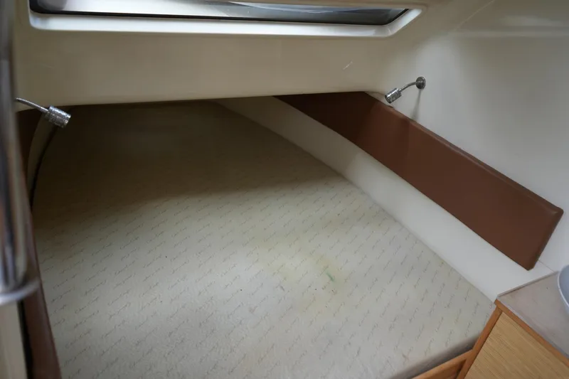Slide: The Image of 2016 Chris-Craft Catalina 34 cabin interior with cozy sleeping area and modern design. - 32