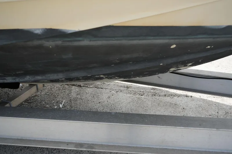 Slide: The Image of 2016 Chris-Craft Catalina 34 boat hull on trailer, showing wear and scratches. - 50