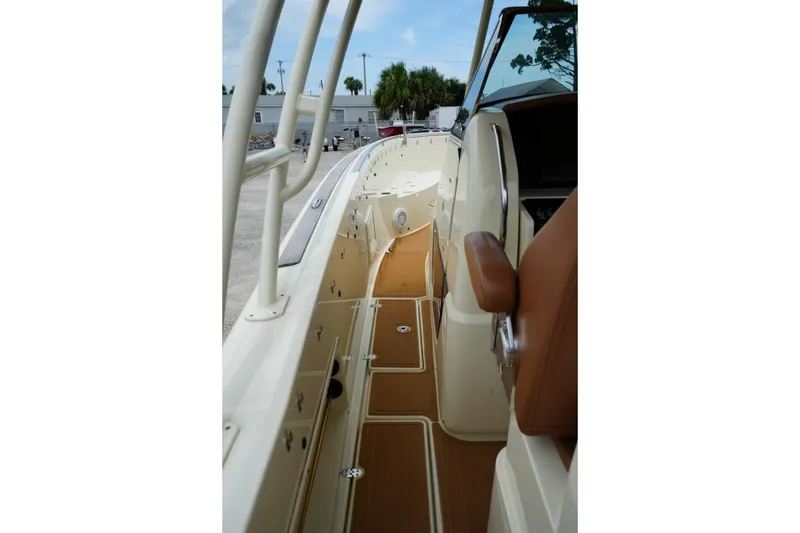 Slide: The Image of 2016 Chris-Craft Catalina 34 boat interior with tan seating and sleek design. - 25