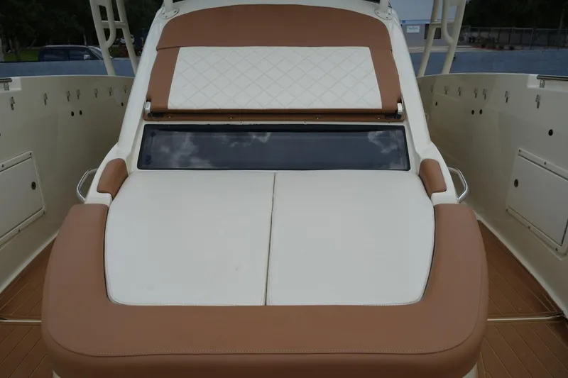 Slide: The Image of 2016 Chris-Craft Catalina 34 boat with luxurious tan and white seating. - 30