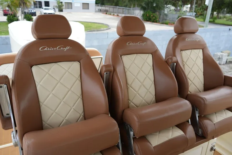 Slide: The Image of Luxurious brown and cream leather seats on a 2016 Chris-Craft Catalina 34 boat. - 27
