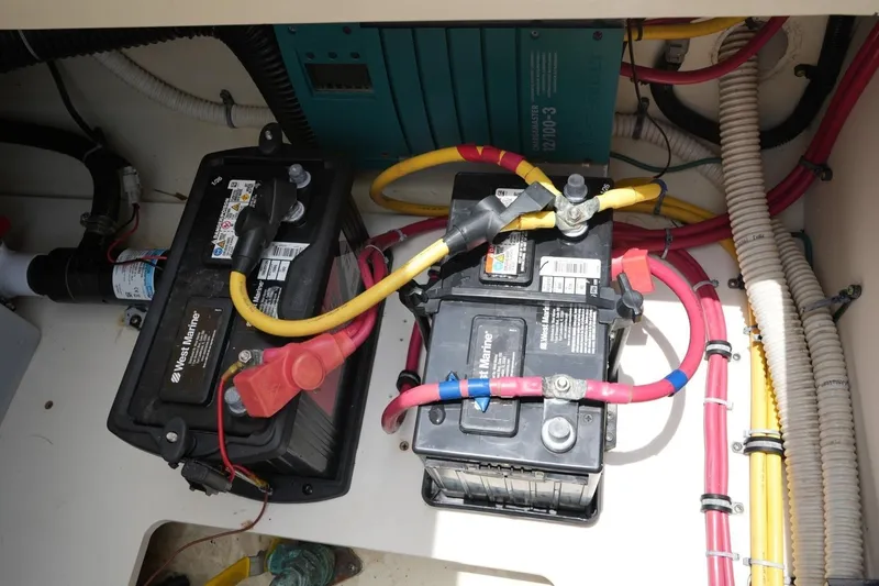 Slide: The Image of Batteries and wiring inside a 2016 Chris-Craft Catalina 34 boat. - 54