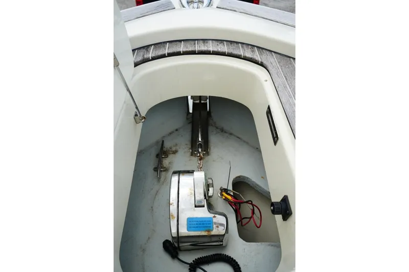 Slide: The Image of Anchor compartment of 2016 Chris-Craft Catalina 34 boat, featuring winch and wiring. - 39
