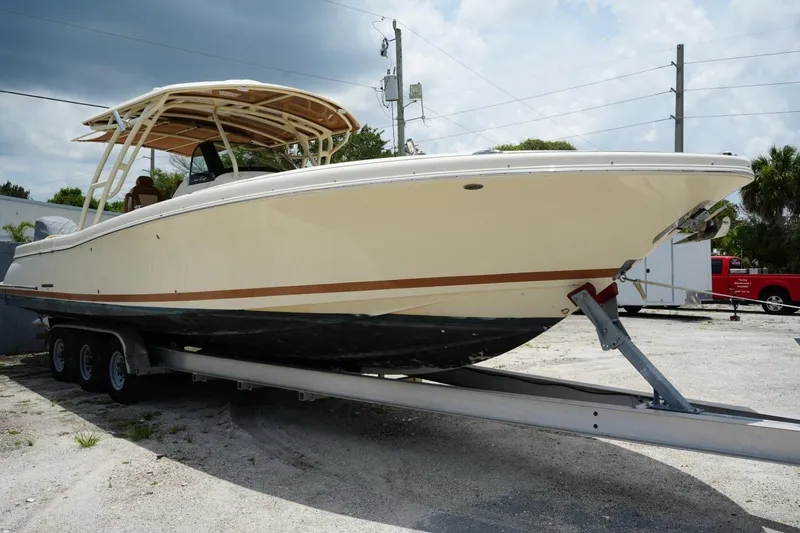 Slide: The Image of 2016 Chris-Craft Catalina 34 boat on trailer, showcasing sleek design and sturdy build. - 10