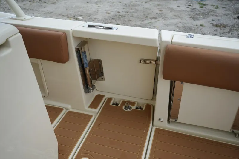 Slide: The Image of 2016 Chris-Craft Catalina 34 boat interior with tan seating and deck details. - 45
