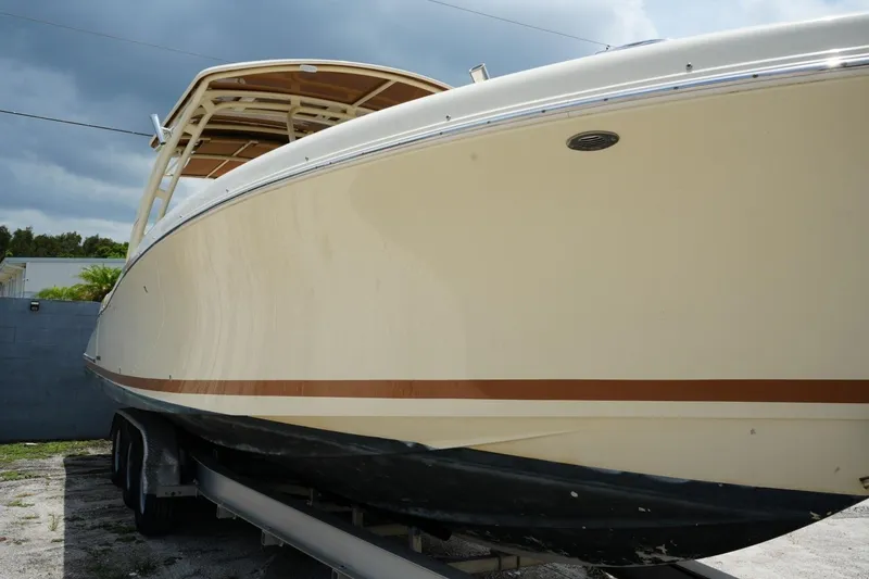Slide: The Image of 2016 Chris-Craft Catalina 34 boat on trailer under cloudy sky. - 9