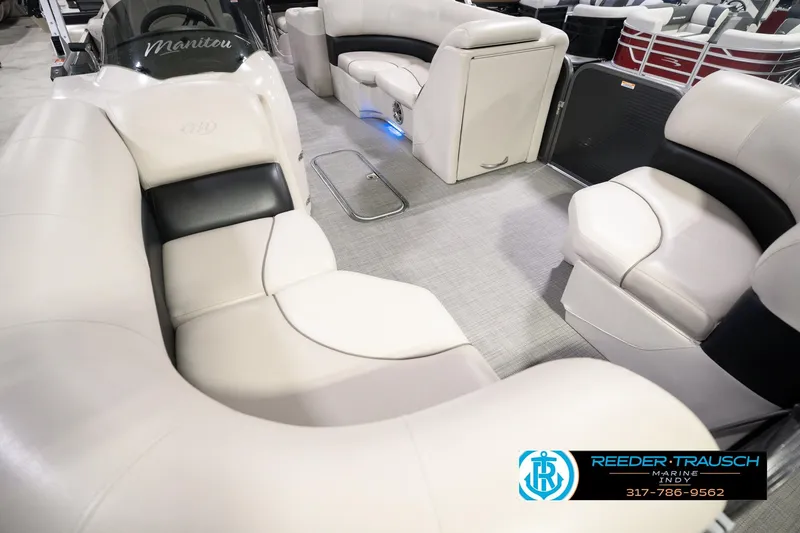 Slide: The Image of 2018 Manitou 23 Oasis RF VP pontoon boat interior with plush seating and modern design. - 14