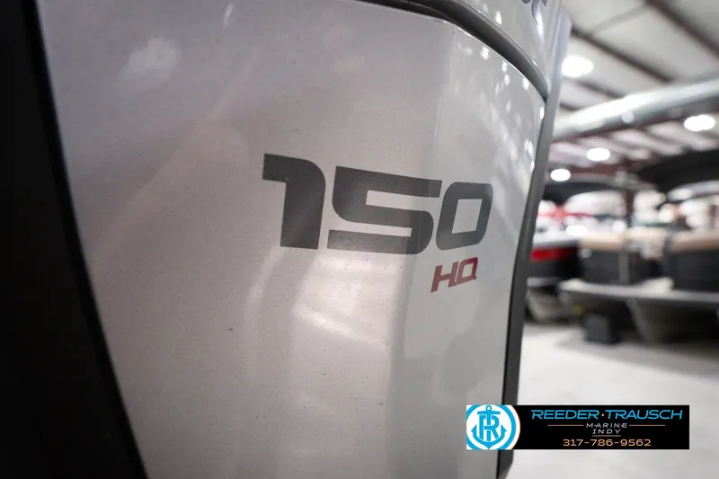 Slide: The Image of 2018 Manitou 23 Oasis RF VP boat with 150 HP engine in showroom. - 64