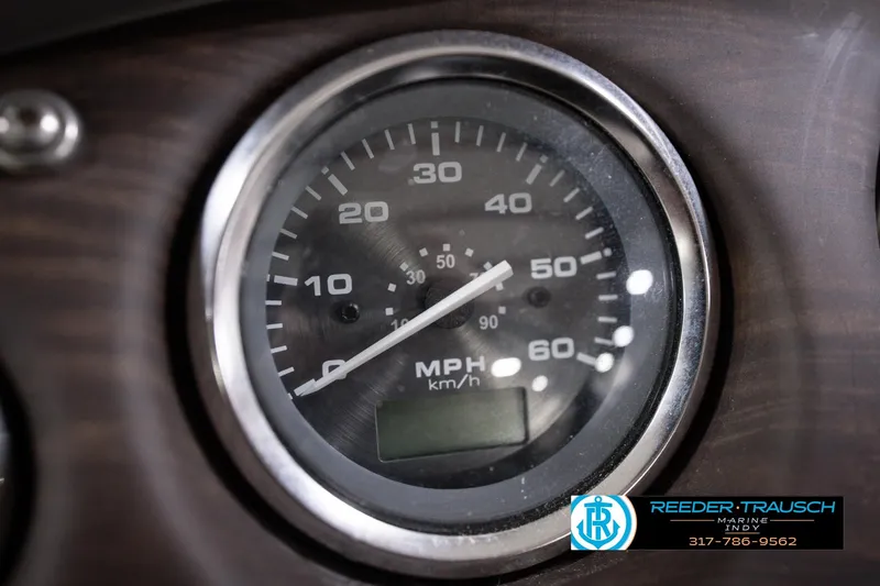 Slide: The Image of Close-up of 2018 Manitou 23 Oasis RF VP speedometer, displaying MPH and km/h. - 47
