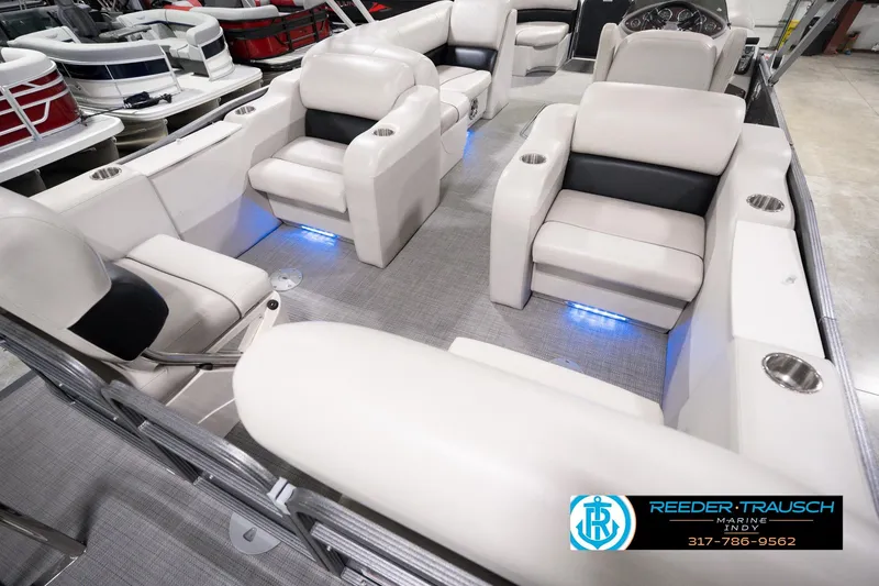 Slide: The Image of Luxurious interior of 2018 Manitou 23 Oasis RF VP pontoon boat with plush seating. - 16