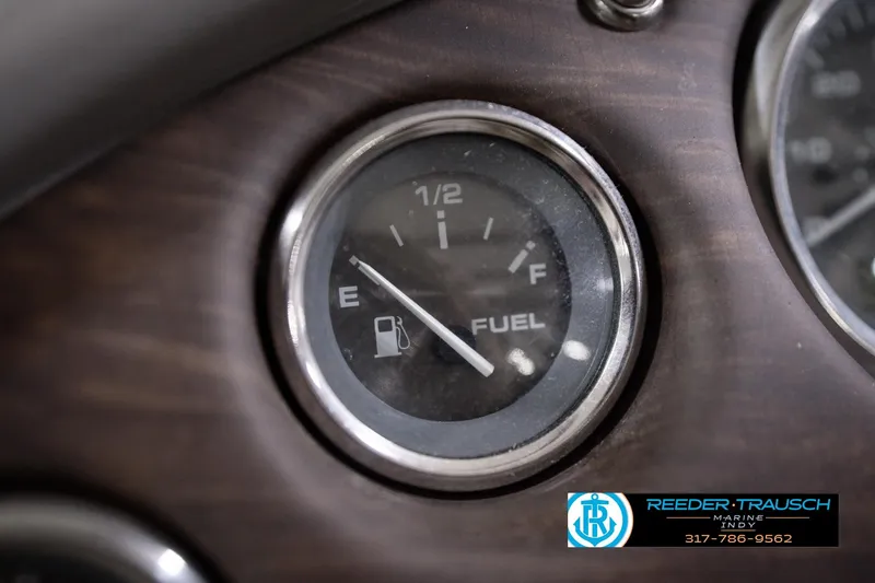 Slide: The Image of Fuel gauge of 2018 Manitou 23 Oasis RF VP boat, showing half-full. - 46