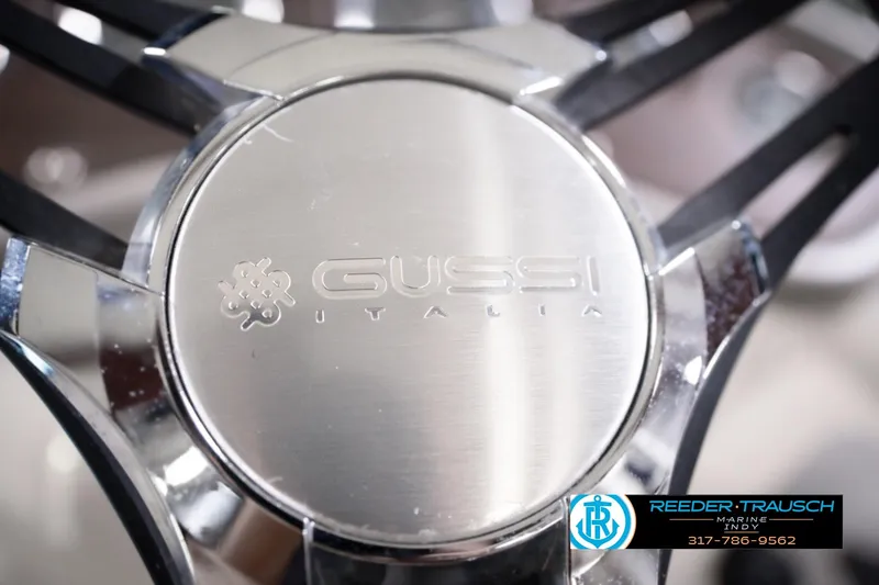 Slide: The Image of Close-up of Gussi Italia steering wheel on 2018 Manitou 23 Oasis RF VP boat. - 43