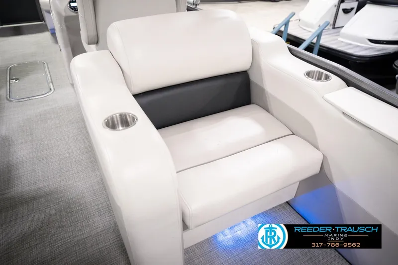 Slide: The Image of Luxurious seating on 2018 Manitou 23 Oasis RF VP boat with cup holders and modern design. - 56