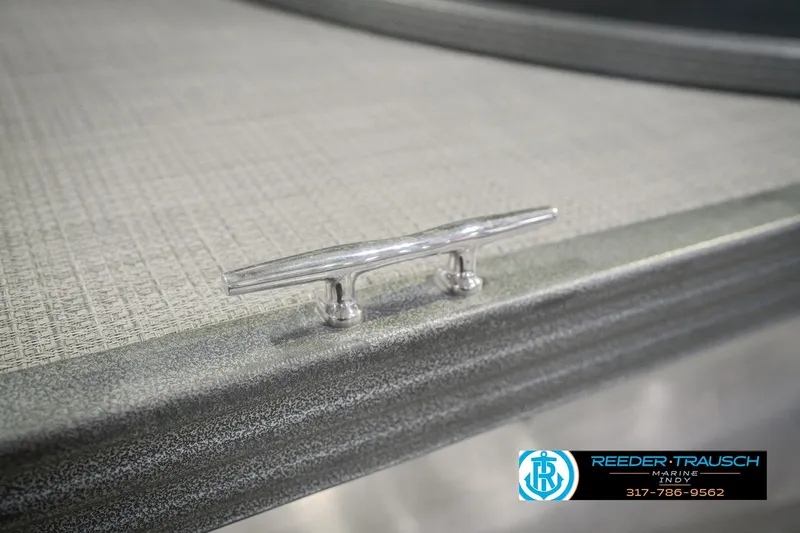 Slide: The Image of 2018 Manitou 23 Oasis RF VP boat cleat on textured deck surface. - 72