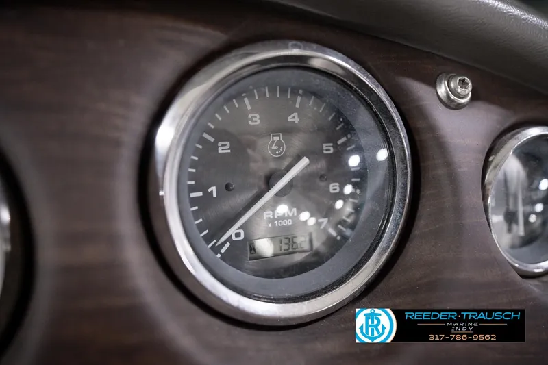 Slide: The Image of Close-up of 2018 Manitou 23 Oasis RF VP tachometer, displaying RPM and hours. - 48