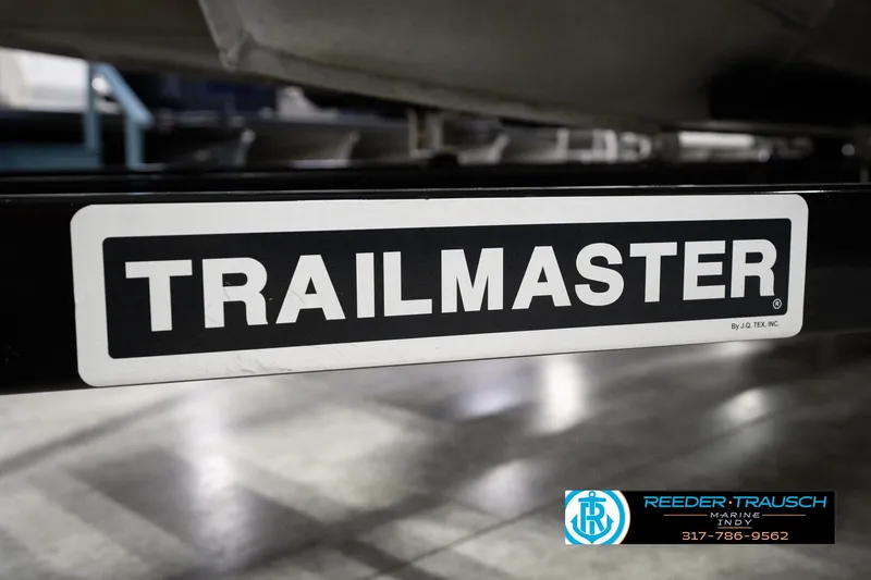 Slide: The Image of Trailmaster trailer label on 2018 Manitou 23 Oasis RF VP boat. - 70