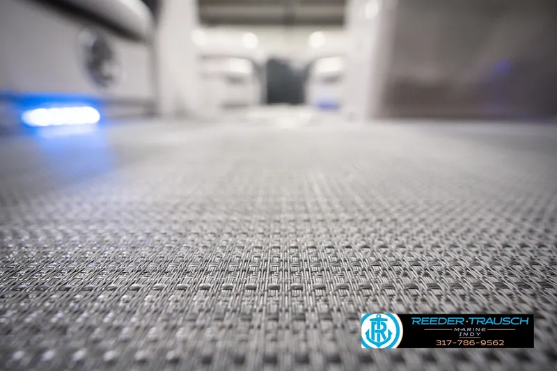 Slide: The Image of Close-up of 2018 Manitou 23 Oasis RF VP boat flooring with ambient lighting. - 61