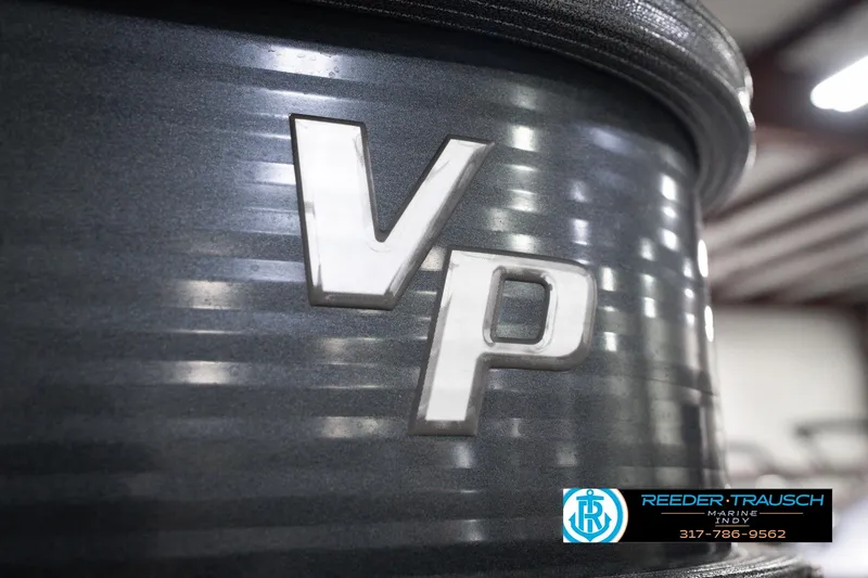 Slide: The Image of 2018 Manitou 23 Oasis RF VP boat detail with VP logo, Reeder-Trausch Marine branding. - 68