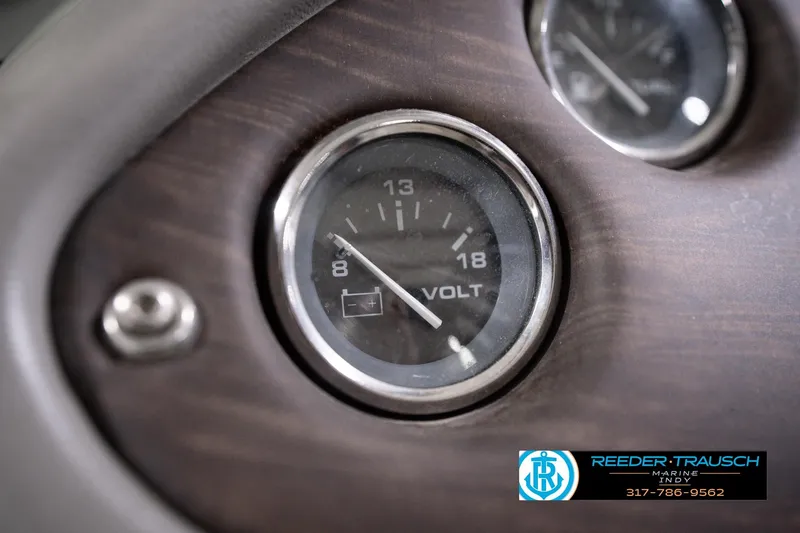Slide: The Image of Close-up of a voltmeter gauge on a 2018 Manitou 23 Oasis RF VP dashboard. - 45