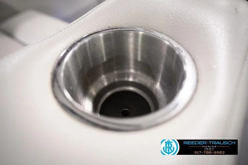 Slide: The Image of Cup holder in 2018 Manitou 23 Oasis RF VP boat, featuring sleek stainless steel design. - 60