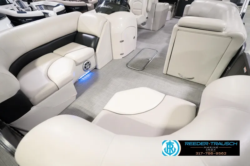 Slide: The Image of 2018 Manitou 23 Oasis RF VP boat interior with plush seating and modern design. - 13
