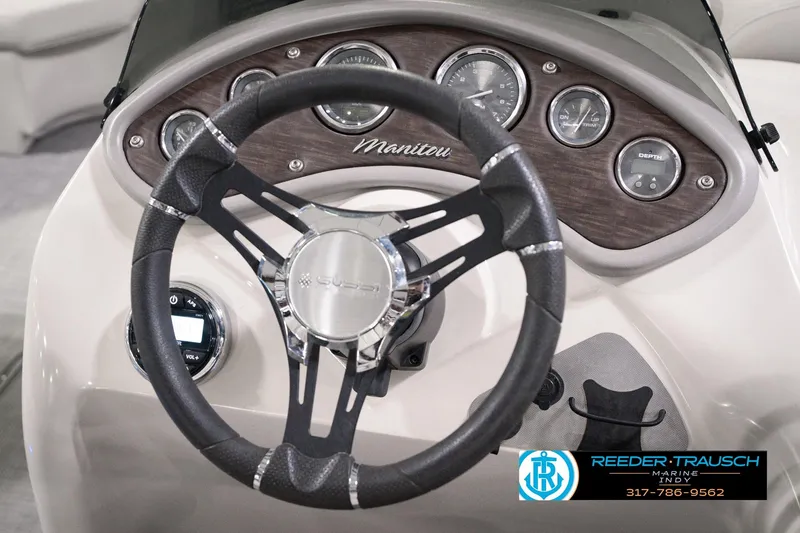 Slide: The Image of Steering wheel and dashboard of 2018 Manitou 23 Oasis RF VP boat. - 41