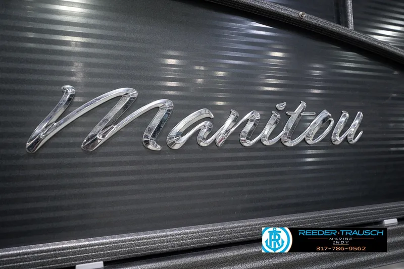Slide: The Image of Chrome "Manitou" logo on 2018 Manitou 23 Oasis RF VP boat. - 67