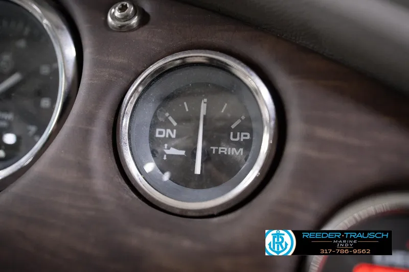 Slide: The Image of Close-up of 2018 Manitou 23 Oasis RF VP trim gauge on dashboard. - 49