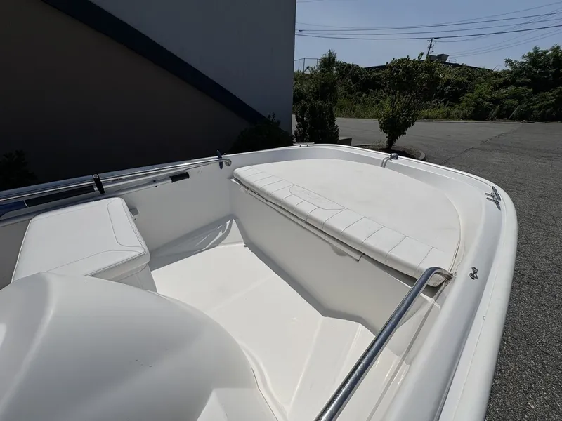 Slide: The Image of The image shows the bow area of a 2009 Boston Whaler 130 Super Sport. - 3