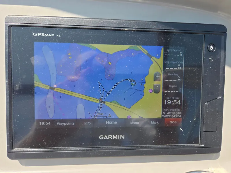 Slide: The Image of A Garmin GPS chartplotter displays a detailed nautical map with routes and waypoints. - 36