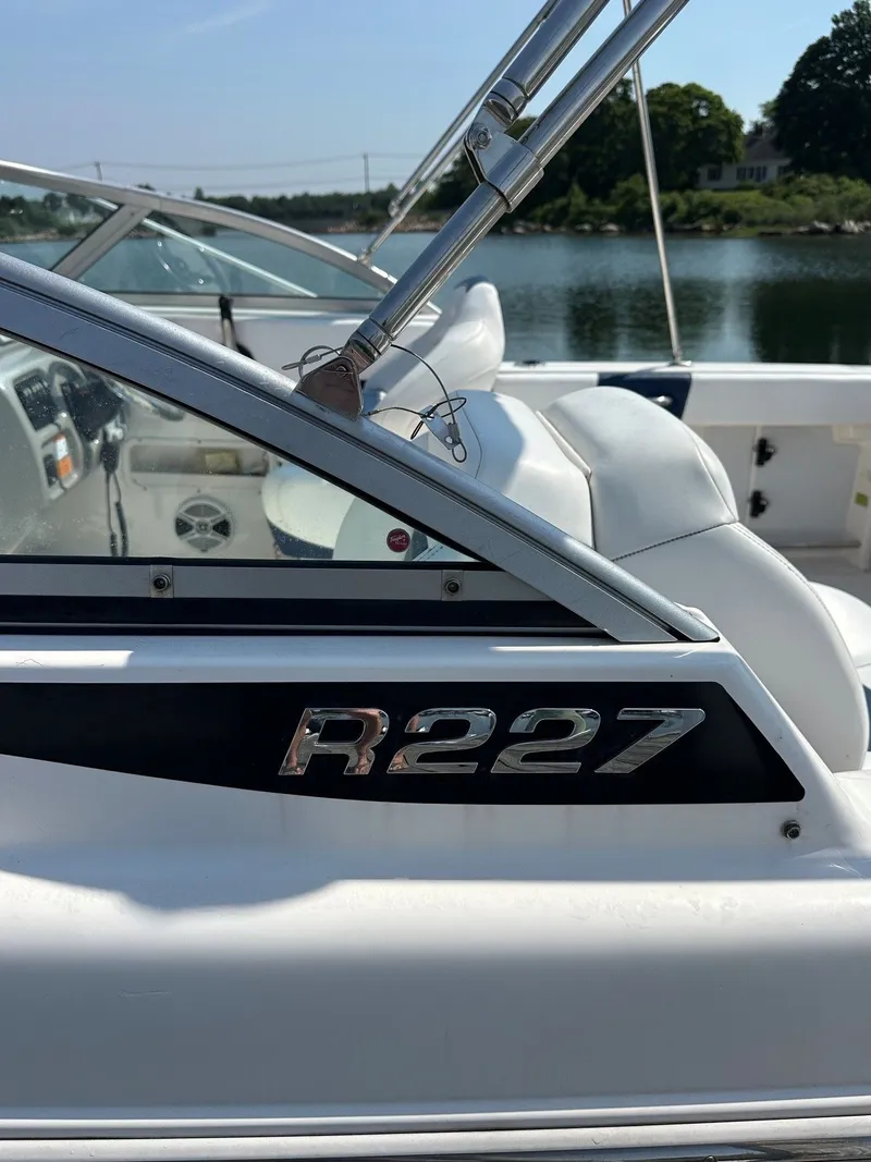 Slide: The Image of Close-up of the 2018 Robalo R227 Dual Console boat on the water. - 4