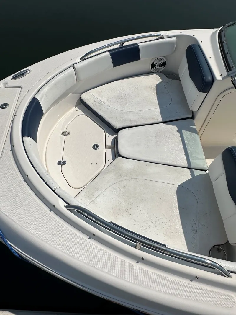 Slide: The Image of The image shows the bow area of a 2018 Robalo R227 Dual Console boat. - 7