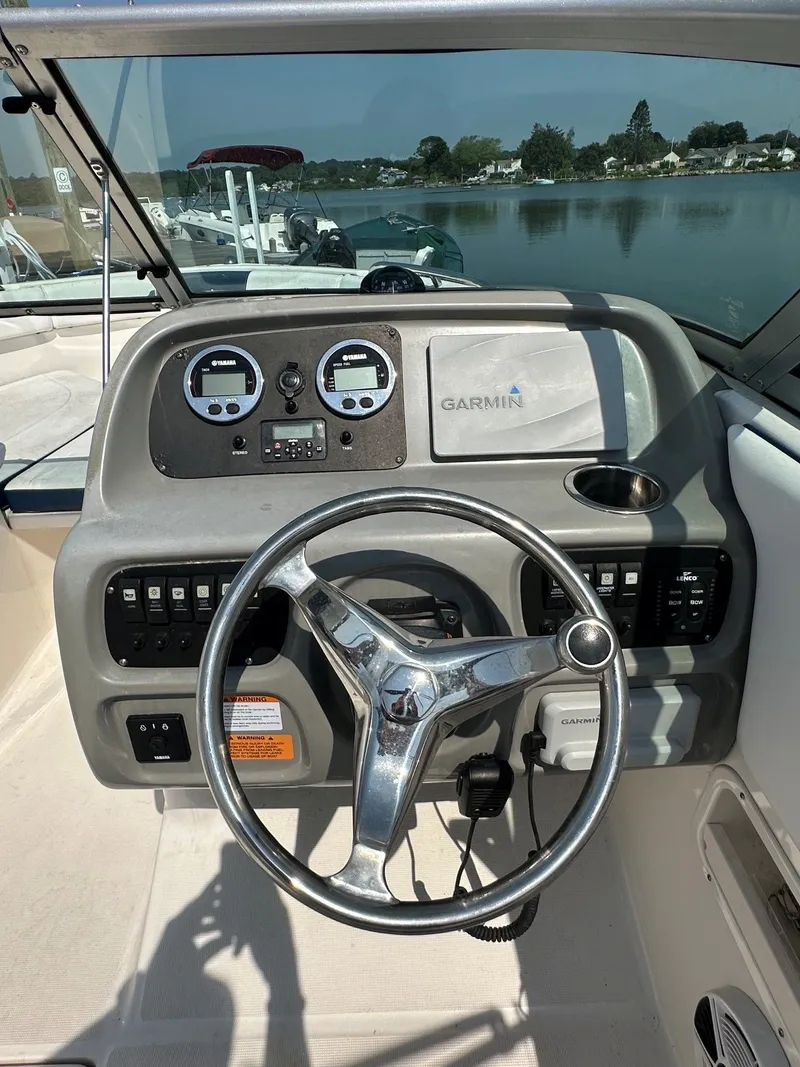 Slide: The Image of The image shows the helm of a 2018 Robalo R227 Dual Console boat with Garmin equipment. - 11